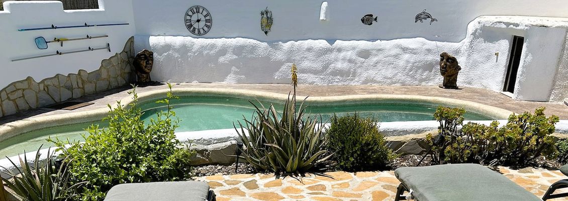 Pool with sunbeds at Casa Limaria